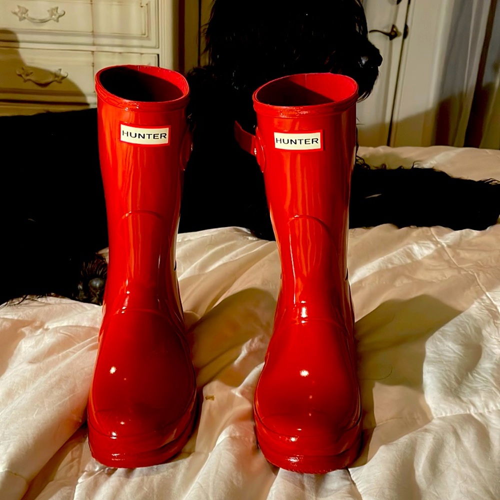 Never worn bright shiny red Hunter Rain boots mid length